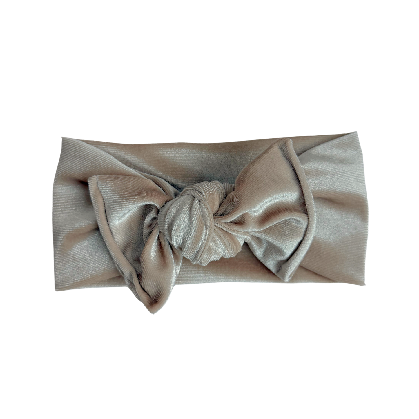 Beige headband with a bow on a white background