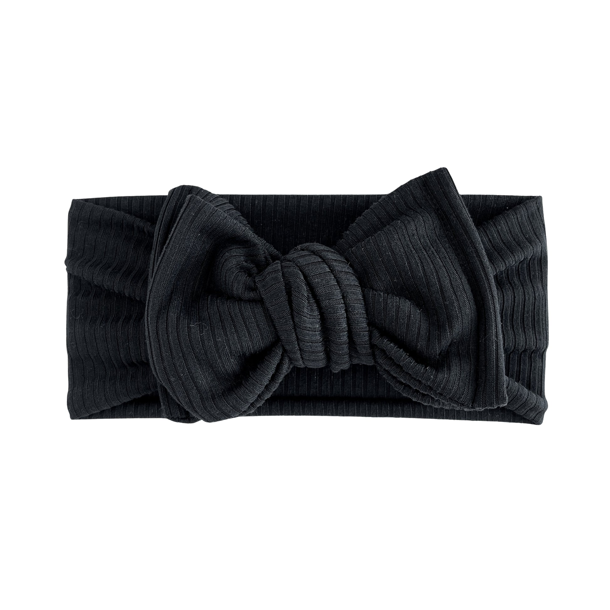 Top knot baby headband in black, crafted from ribbed knit fabric, displayed on a white background