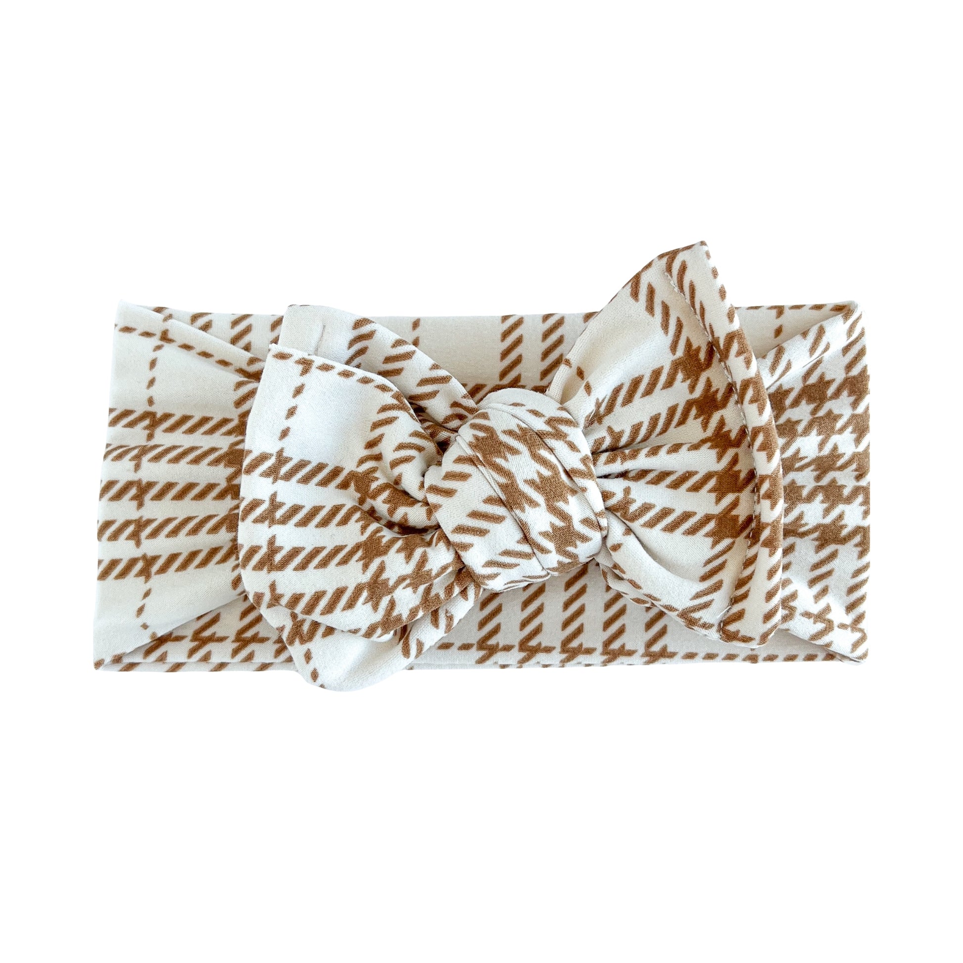 Oversized bow baby headband in beige and brown fall plaid print, crafted from double brushed knit fabric, displayed on a white background