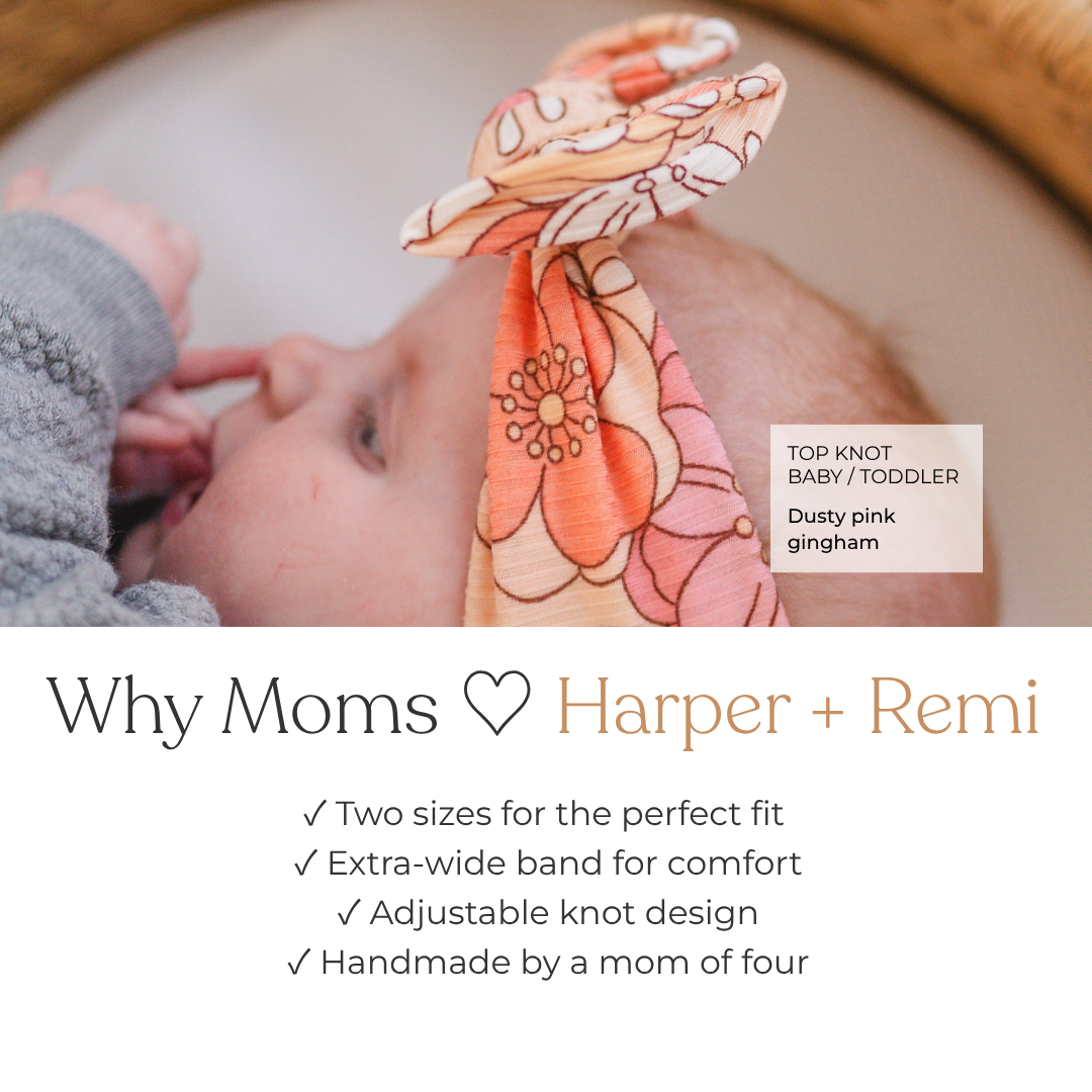 A baby wearing a coral floral top knot headband, with a text overlay explaining the fit and features of the Harper + Remi product.