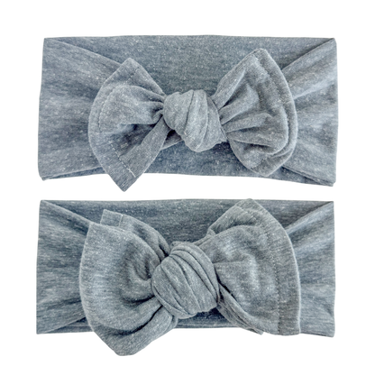 Baby girl headbands in top knot and oversized bow styles in blue gray, made from cotton knit fabric