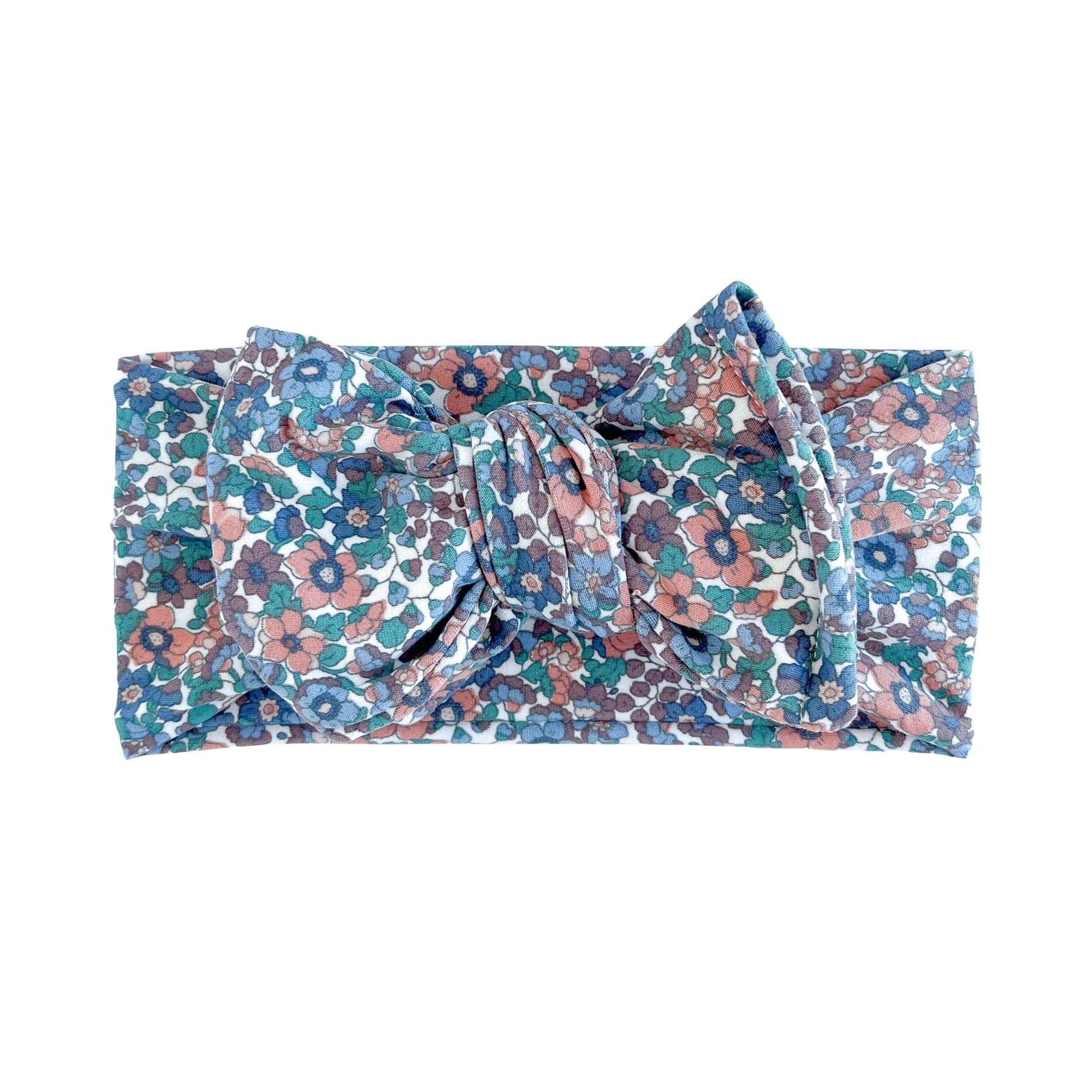 Oversized bow baby headband in dusty purple floral print, crafted from double brushed knit fabric, displayed on a white background