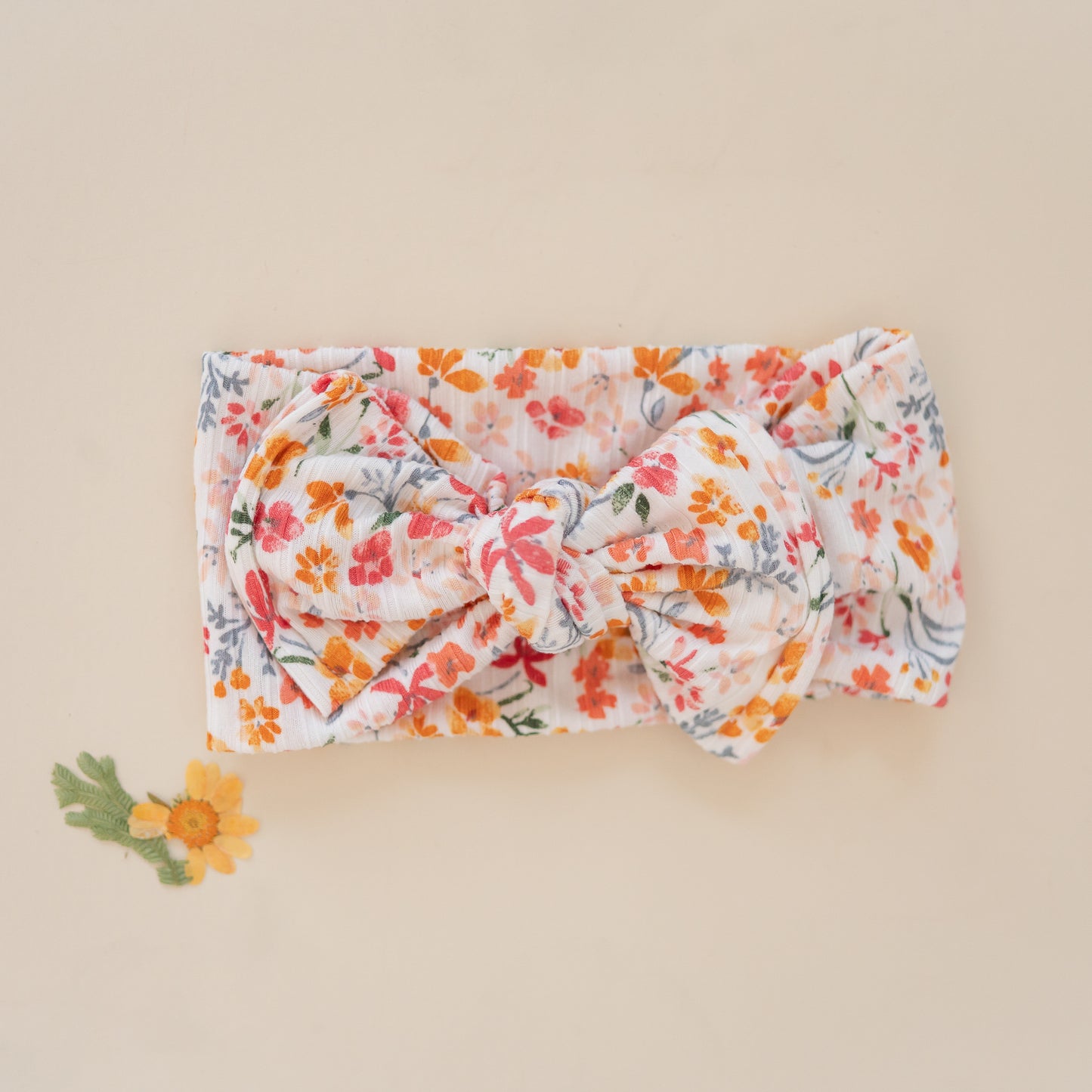 Floral headband on a beige background