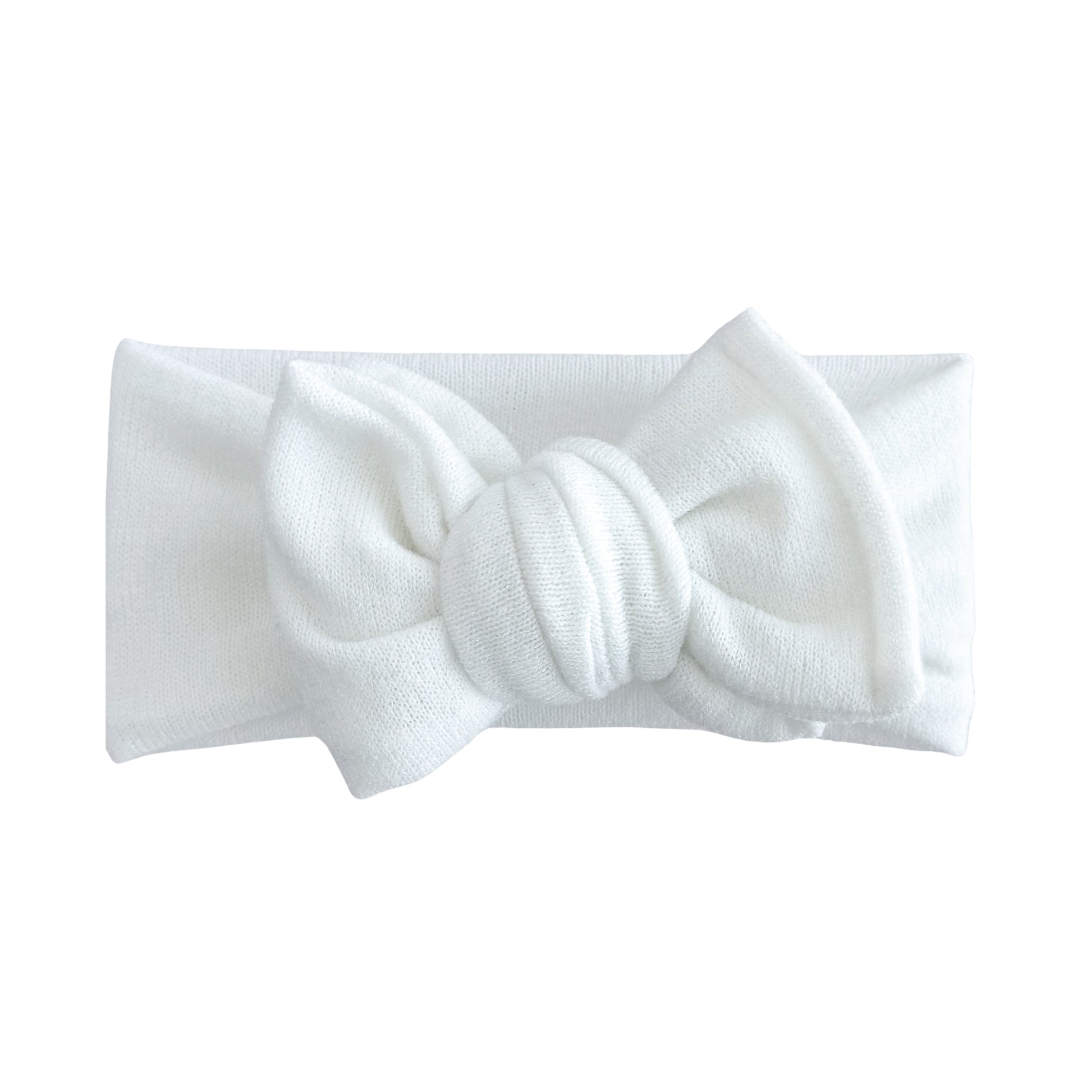 Oversized bow baby headband in ivory, crafted from stretchy terry cloth knit fabric, displayed on a white background