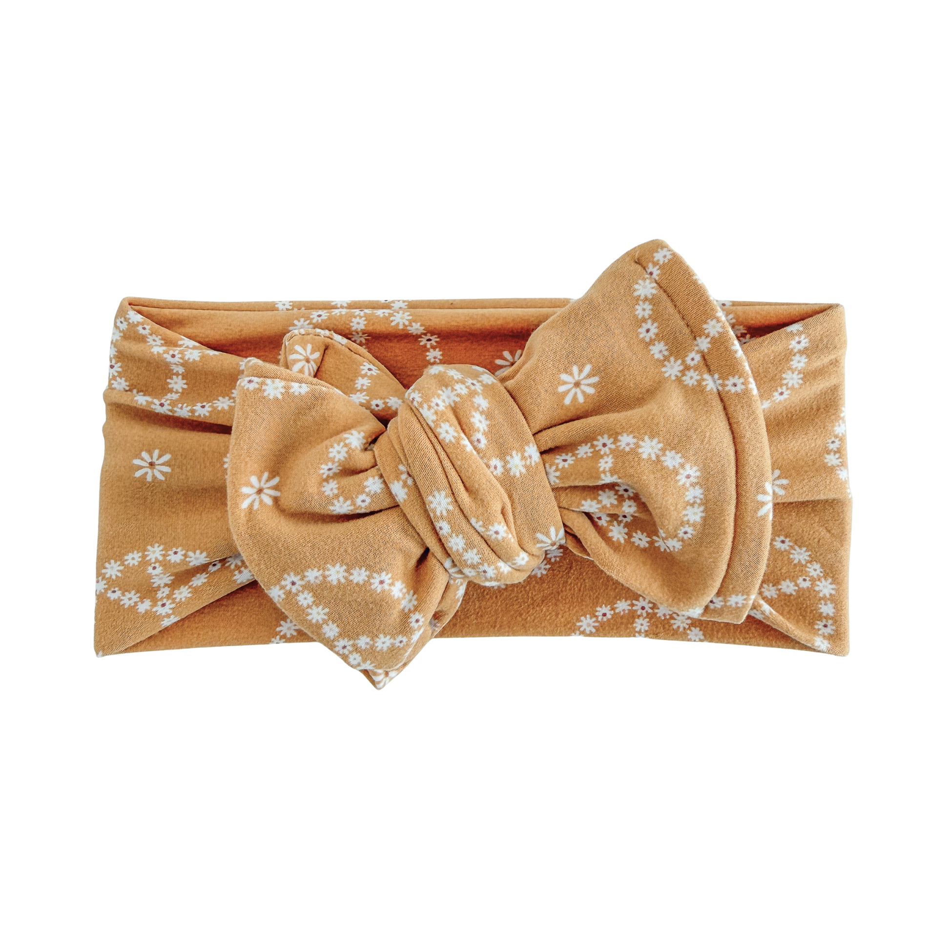 Marigold headband with a large bow and white floral pattern on a white background