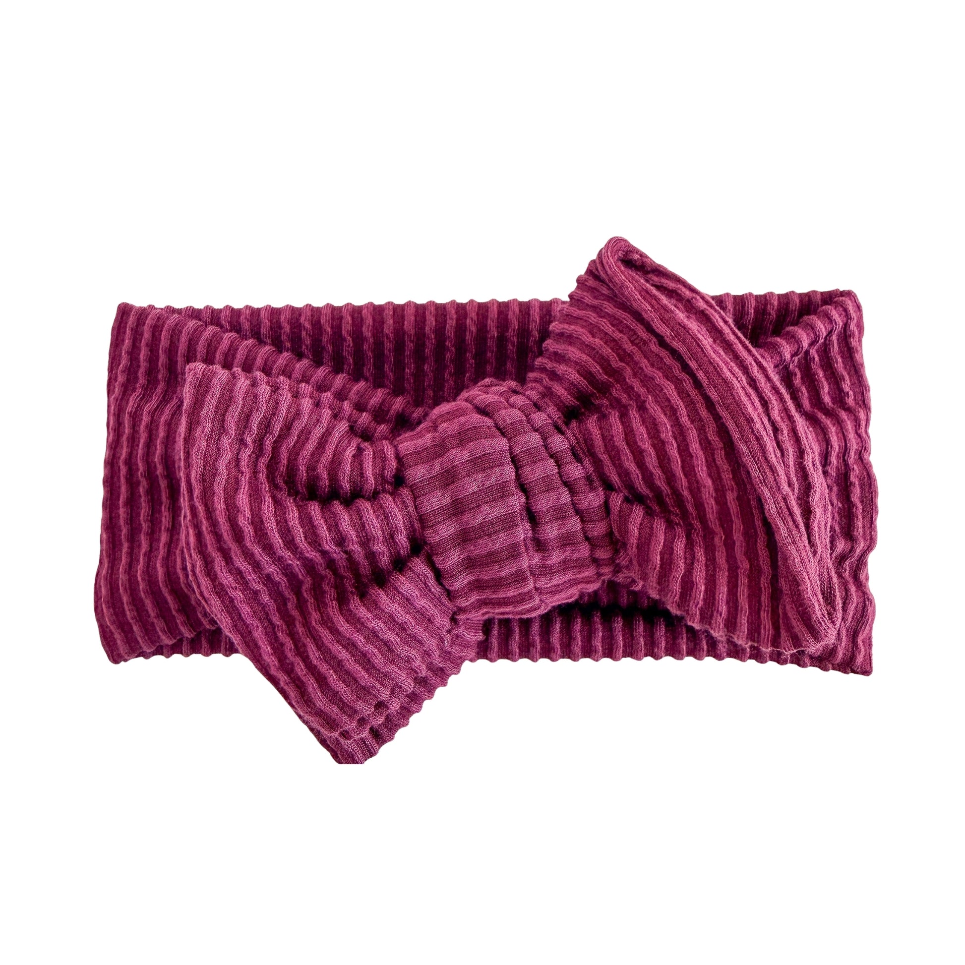 Oversized bow baby headband in maroon (dark purple), crafted from wavy ribbed knit fabric, displayed on a white background