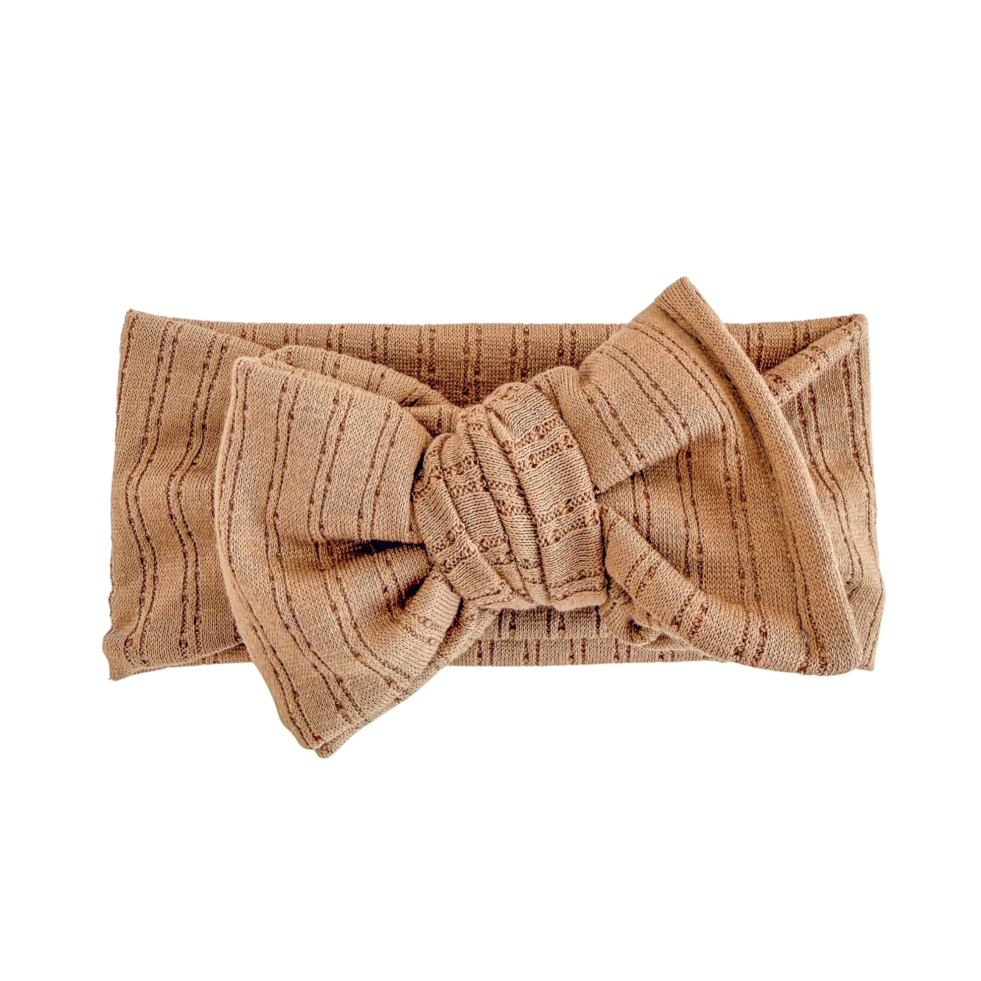 Oversized bow baby headband in mocha (dark brown) crafted from pointelle knit fabric, displayed on a white background