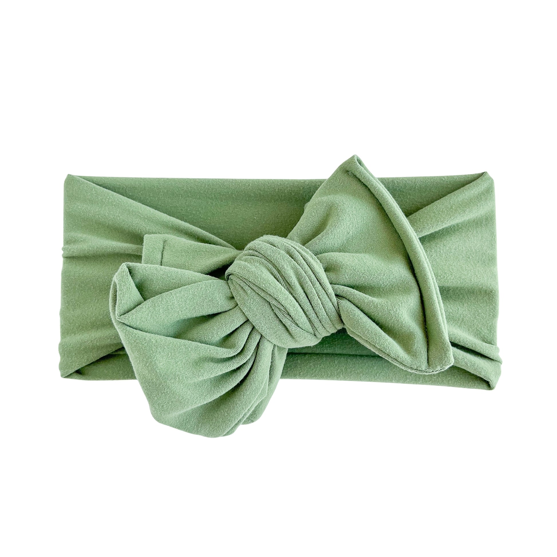 Oversized bow baby headband in olive green, crafted from double brushed knit fabric, displayed on a white background