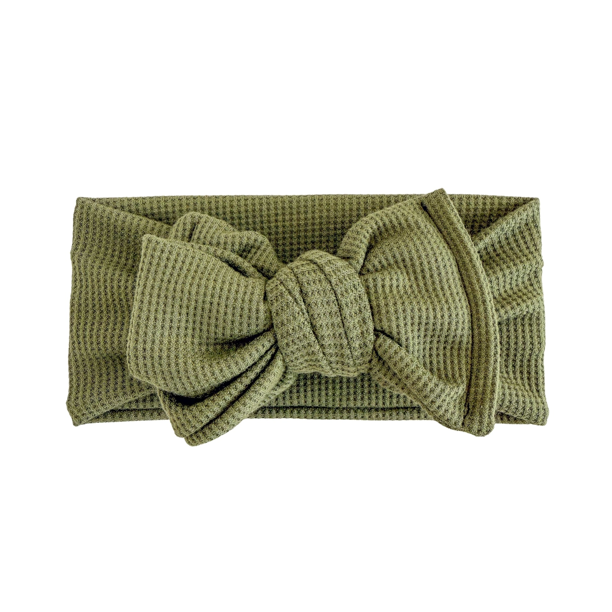 Oversized bow baby headband in olive green, crafted from waffle knit fabric, displayed on a white background
