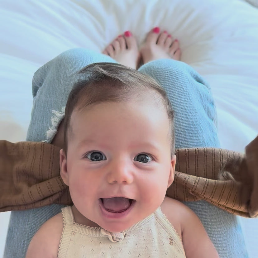 Tutorial video showing how to tie a mocha pointelle top knot bow.