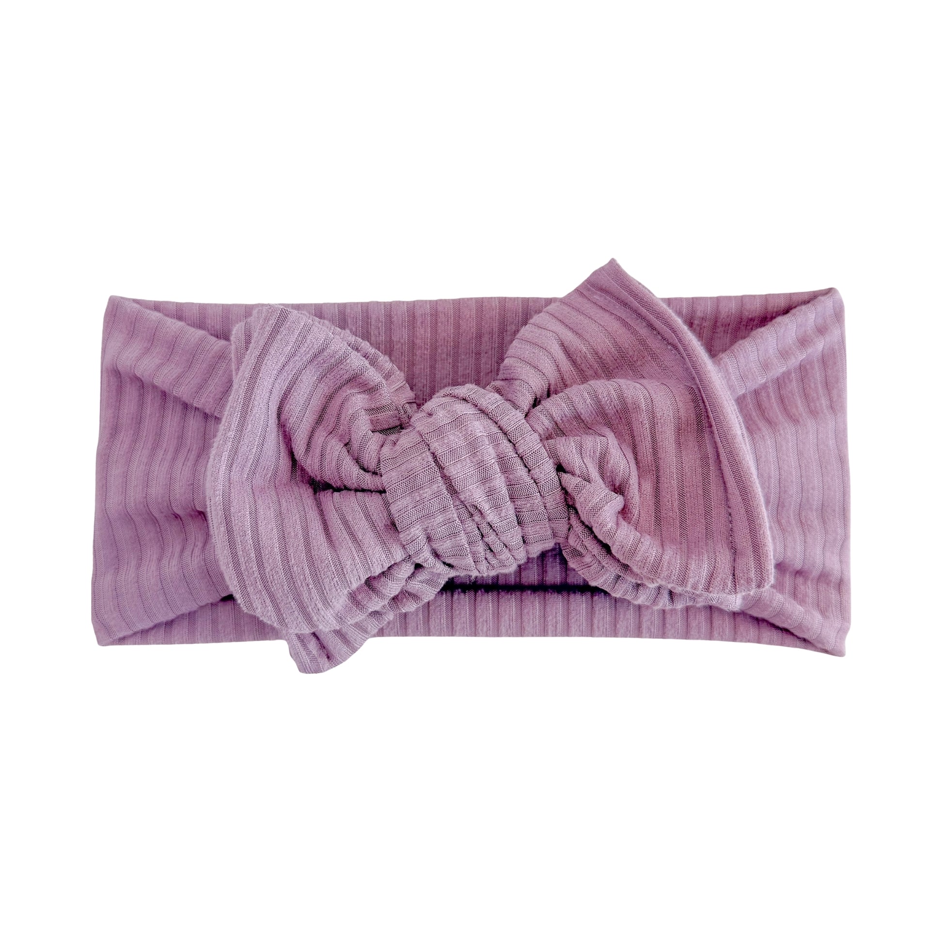 Oversized bow baby headband in purple, crafted from ribbed knit fabric, displayed on a white background