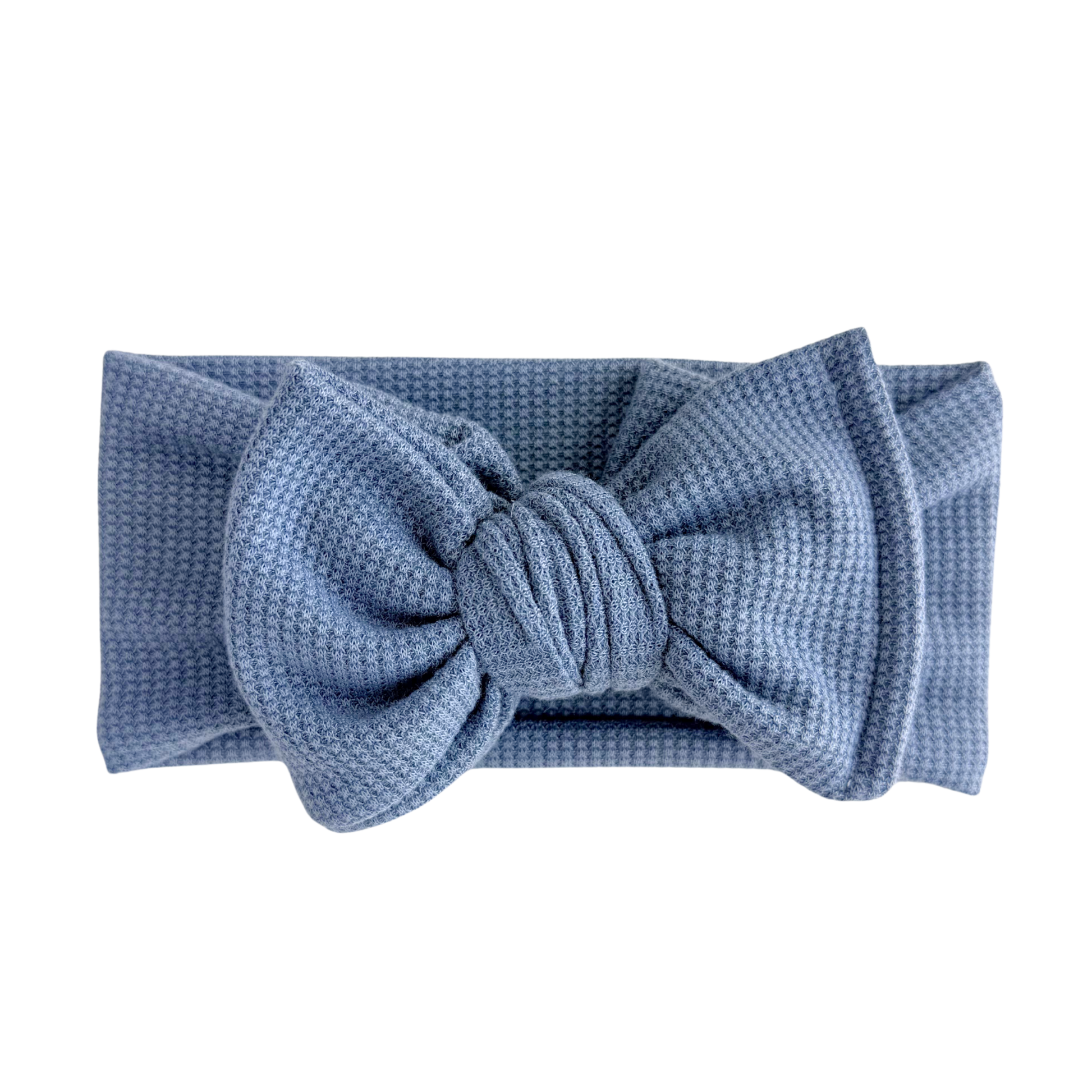 Dusty blue waffle oversized bow headband on a white background