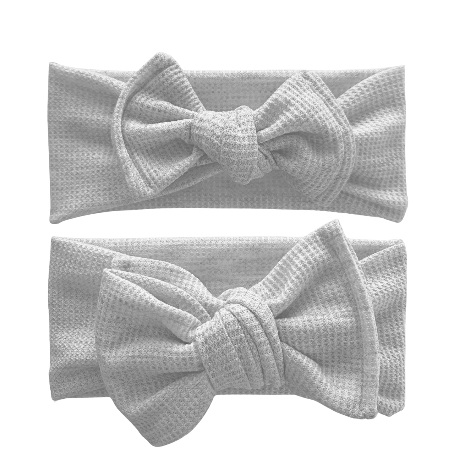 Two gray waffle knit headbands with large bows on a white background. Top is a top knot, bottom is an oversized bow.