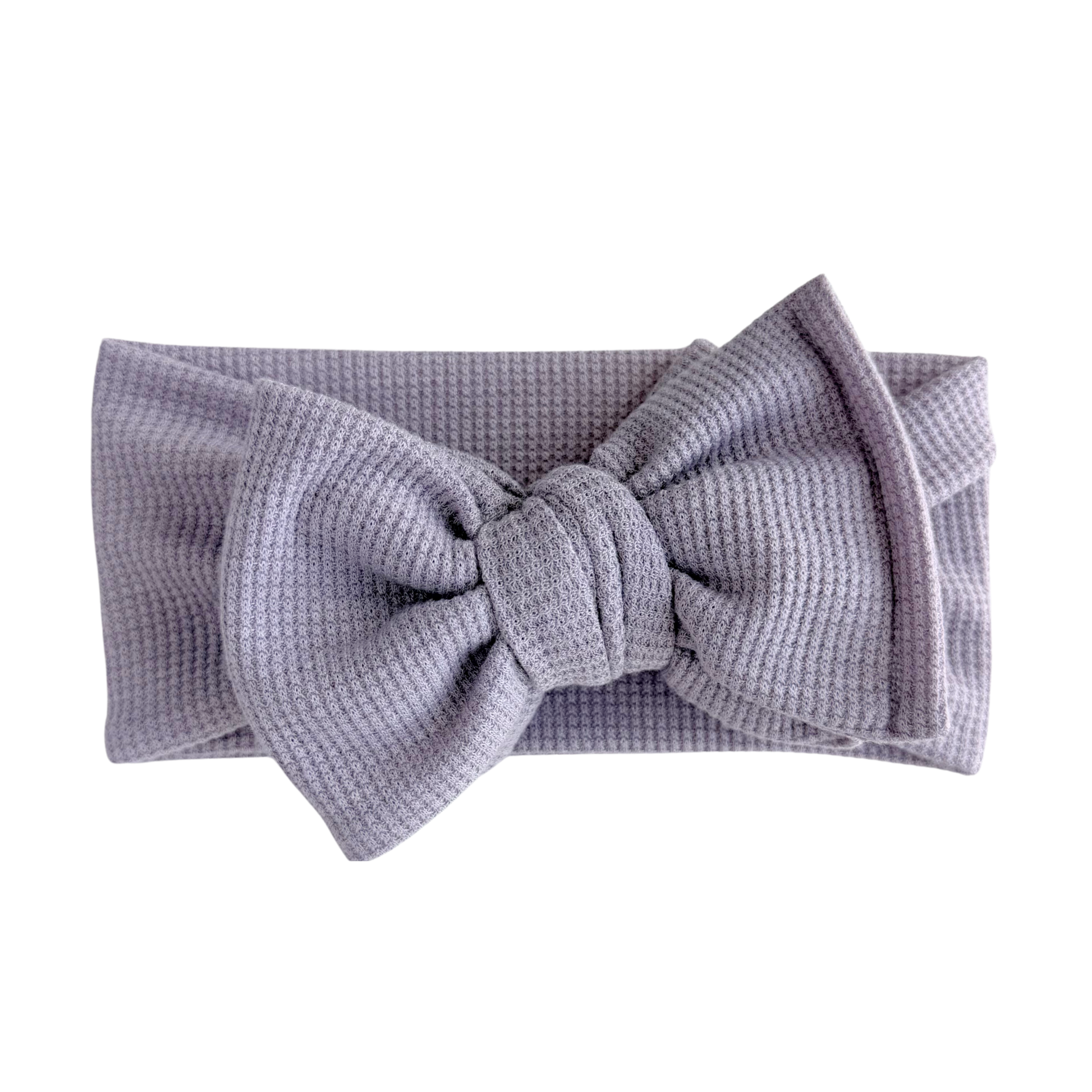 Lavender waffle oversized baby bow headband a white background.