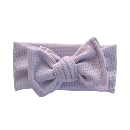 Lavender waffle oversized baby bow headband a white background.