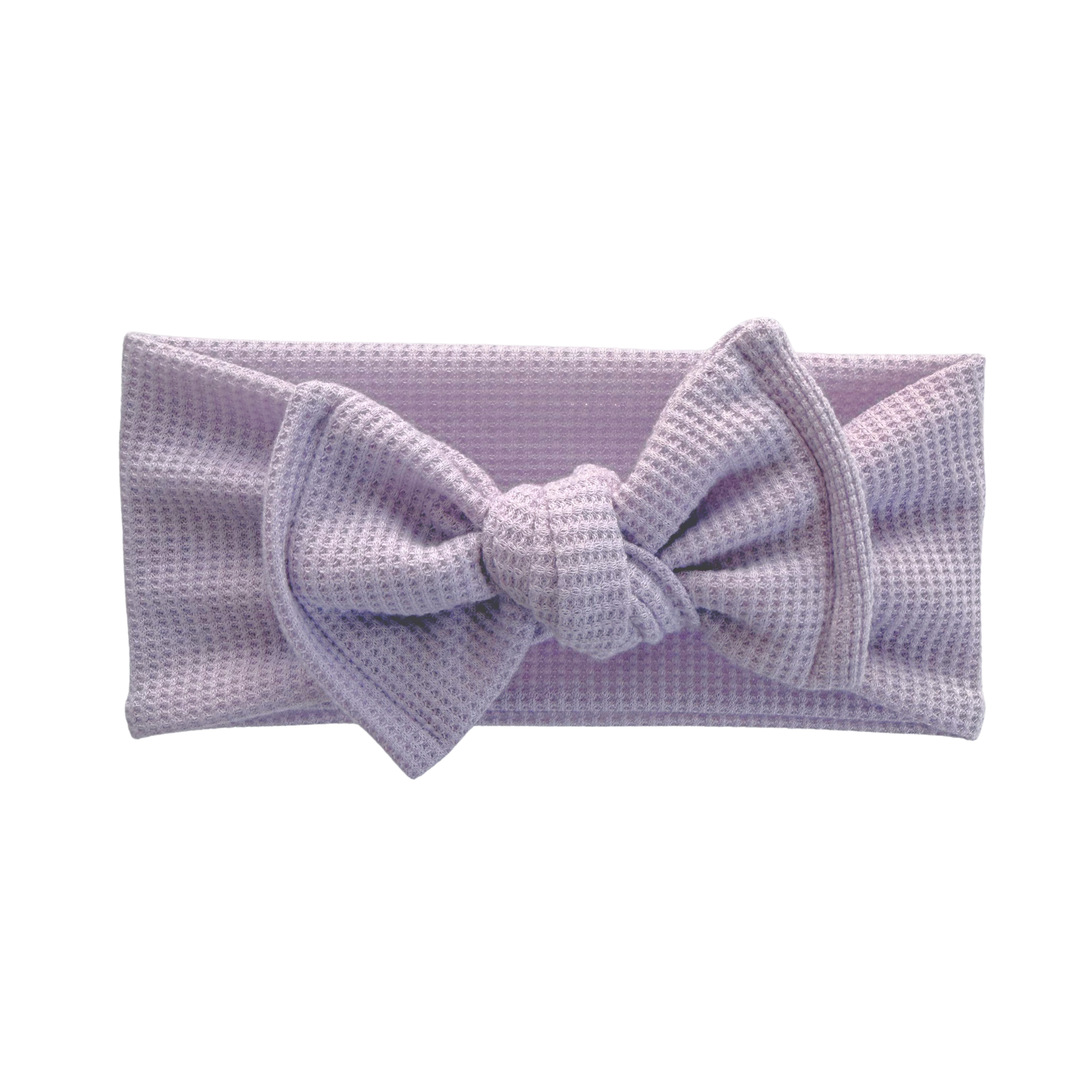 Lavender waffle top knot baby bow headband a white background.